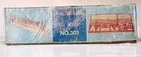 Front view of shrink-wrapped original box with 'billing boats NO.301' label, image of the building slip and parts layout on the packaging.