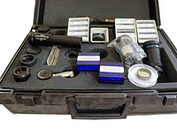 Lot contents with Orion 2x Barlow lens, multiple labeled filter boxes, lenses, and other accessories in foam cutouts of molded plastic case.