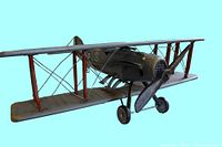 Side angle of WWI RAF Fighter model bi-plane showing olive green fuselage, red wing struts, and detailed wire rigging between wings.