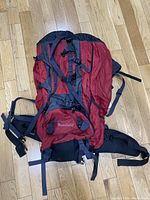Top view of the camping backpack showing the front compartments and straps