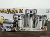 Photo of a boxed 4-piece stainless steel airtight canister storage set.