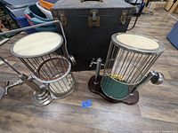 Shows both vintage carnival dice games side by side with carrying case behind