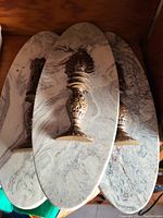 View showing all three chess-themed wall décor plaques stacked, each with a distinct chess piece mounted on an oval marble-like base.