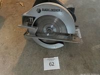 Full view of Black & Decker circular saw showing blade guard, blade and body with visible logo.