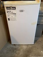 Front view of the Chef mini fridge showing the logo and energy guide label.