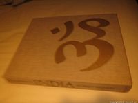 Beige cloth hardcover book titled 'India' with stylized design on cover and spine text