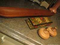 Image showing the long carved teak tray, Kashmiri paper mache floral box, and two sandalwood jewellery holders.