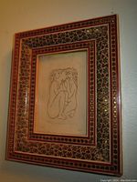 Framed ink drawing hung on wall showing full frame and artwork