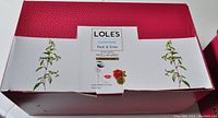 Closed case showing LOLES branding and rose water make up removing micellar wipes.