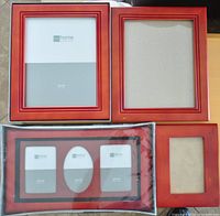 Four picture frames including 8x10, 5x7, 6x4, and a multi-photo frame with two 3.5x5 slots and one oval slot with red wood finish.