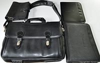 Photo of the black leather Dell laptop bag with shoulder strap and two black RingCentral portfolios or folders.