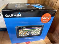 Box of Garmin Nuvi 255W GPS navigator showing front with color display and brand name.