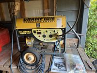 Generator with wheel kit and owner's manual on wooden shelf