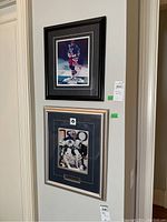 Both framed photos displayed on wall, top Wayne Gretzky, bottom Curtis Joseph