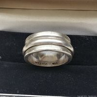 Close-up of sterling silver ring showing 'MEXICO 925' stamp inside band.