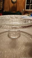 Close-up of the crackle pattern on the glass pedestal cake plate's surface and edge, highlighting the textured design.