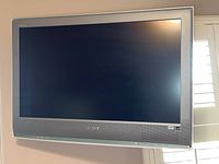Full front view of the flat screen Sony TV model KDL-32S2000 with screen turned off