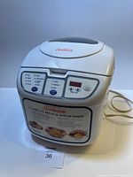 White Sunbeam bread machine showing the front view and product label.