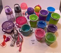 All items grouped showing cups, bottles, snack containers and accessories in lot