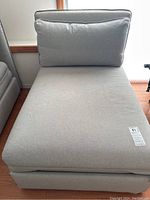 Front view of grey chaise lounge sofa bed