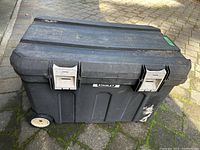 Front view of the Stanley construction tote showing overall size and wheels.