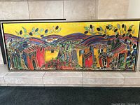 Full front view of the colorful abstract canvas print with black frame and vibrant leaf and wave patterns.