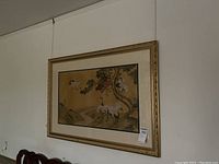 Full view of framed Asian bird print showing the ornate gold frame, overall size, and image composition with cranes and landscape.