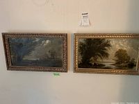 Two landscape canvases hung side by side against wall