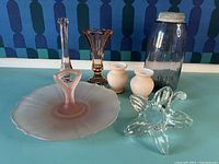 Overall view of all items including vases, mason jar, frosted pink handled plate, and clear depression glass bowl