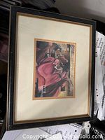 Framed artwork showing the full piece including the frame and matting.