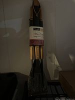 Three-piece Charmglow BBQ tool set packaged and tied together with a label.