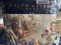 Photo of Ralph Lauren Home queen size sheets in original packaging, showing floral pattern and branding.