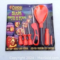 Front view of the Pumpkin Masters All in One Carving Party Kit in original packaging showing 8 carving tools including scoops and saws.
