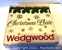Photo of the original Wedgwood Christmas Plate box with holiday holly and snowflake design on front and Wedgwood brand name.
