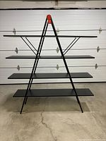 Front view of the full triangular shelving unit