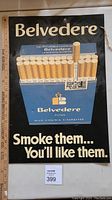 Front view of the 23x15 inch Belvedere cigarette metal sign showing brand name, cigarette pack illustration, and slogan.
