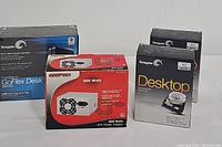 All items in lot displayed: 2 Seagate 1TB internal HDDs, 1 Seagate FreeAgent 2TB external HDD, 1 COMP USA 300 Watt PSU in retail boxes.