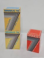 Three boxes: two yellow boxes labeled Realistic Minimus 7W Walnut speakers and one red box labeled Realistic Minimus 20 speaker.