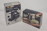 Both items in their original boxes shown side by side, including packaging details.