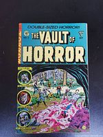 Front cover of The Vault of Horror Issue No. 2 comic book showing colorful horror-themed artwork and title.