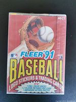 Front of sealed 1991 Fleer '91 Baseball Cards box showing baseball glove, ball, and details of stickers and trading cards included.