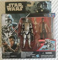 Front view of the sealed Star Wars Captain Phasma and Finn action figures set in original blister packaging with visible branding and character art.