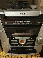 Front view of RCA 5-disc CD player stereo system with control panel and display