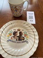 Cup with portrait of Charles and Diana in royal attire with decorative motifs