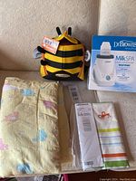 Overview of all items: bee backpack, pillowcase, duvet covers, and bottle warmer
