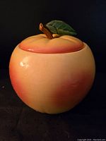 Side view of the apple-shaped cookie jar showing gradient coloration and overall shape.