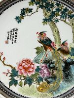 Close-up of front decoration showing phoenix, chrysanthemum and Chinese inscription