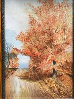 Close-up of watercolor painting showing fall trees and country road with detailed warm autumn foliage.