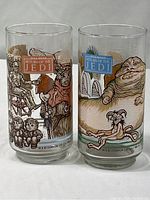 Front view of two Return of the Jedi glasses showing various characters and logos
