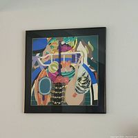 Frontal image of the framed painting depicting food baskets in bright, abstract colors.